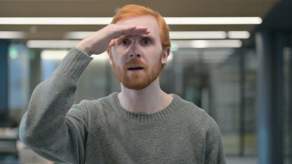 Portrait of Young Man Looking Around Searching