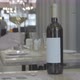 the hand of the waiter puts a glass of wine on the table in the restaurant. 4k - VideoHive Item for Sale