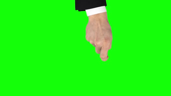 Man Hand in Black Jacket and White Shirt Performing Swipe Down at Tablet Screen Gesture on Green