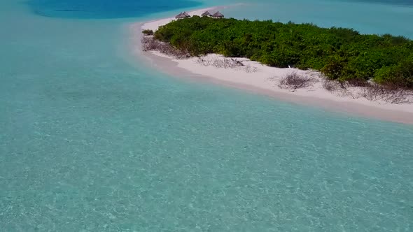 Drone aerial nature of shore beach break by blue lagoon and sand background