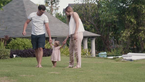 Caucasian Family Walking in Garden