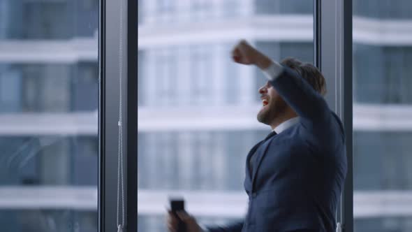 Happy Office Worker Celebrating Corporate Good News in Business Office Building