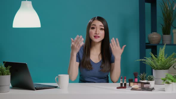 Asian Woman Filming Makeup Tutorial for Online Channel