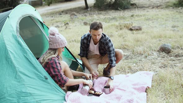 Camping Couple Eating Breakfast Drinking Tea or Coffee