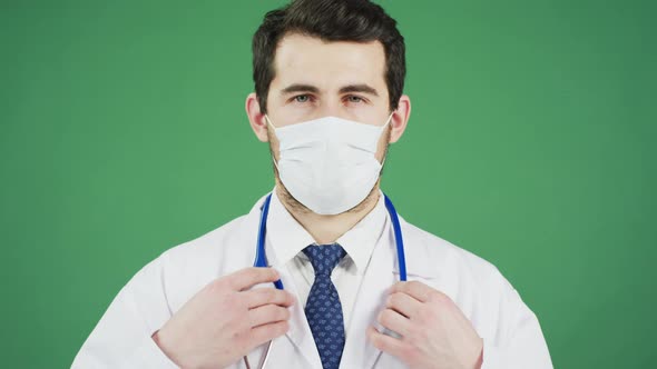 Doctor putting stethoscope around his neck