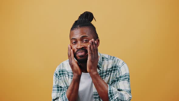 Young African American Male Smiling Acting Like Looking Into Mirror Straightening Beard