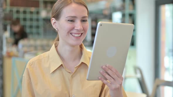 Portrait of Video Chat on Tablet By Young Woman