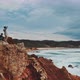 Two men on top of the coastal cliffs shot by drone - VideoHive Item for Sale