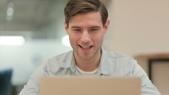 Close Up of Creative Young Man Doing Video Chat on Laptop