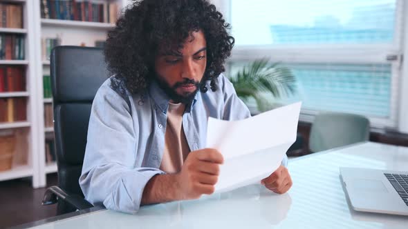 Pissed Off Young Indian Business Man Reads Document Then Tosses It Out of Anger