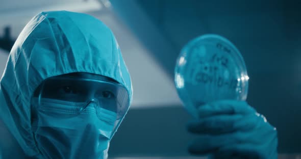 Scientist Examining Coronavirus Sample in Laboratory