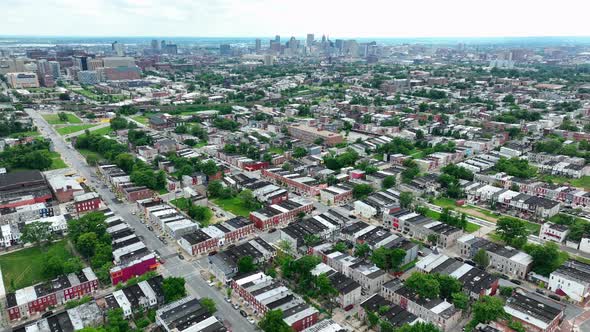 High aerial of American city during summer day. Residential housing and skyscrapers on skyline in di