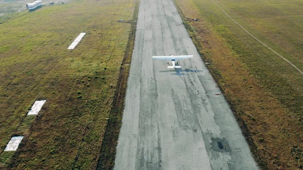 Top View of a Small Aircraft Taking Off From the Runway