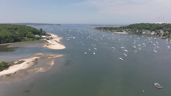 An aerial time lapse over the Northport Marina on Long island, NY. It is a sunny day with many ancho