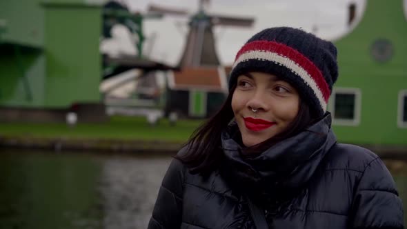 Portrait of Smiling Dutch Teen Girl with Traditional Mill in Background, Happy Smile