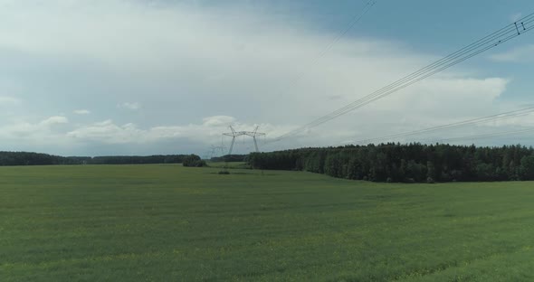 Power Line Industrial View on the Line of Electric Transmissions in Field Steel Towers with Wires