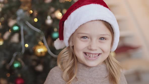 Grade Schooler in Santa Hat Smiling