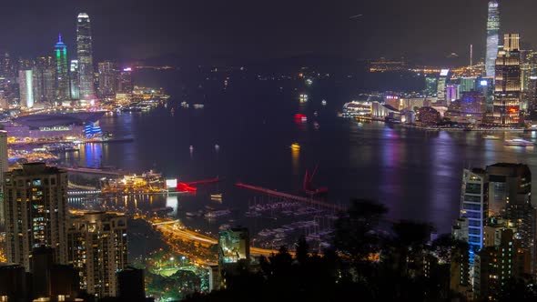 Hong Kong Urban Cityscape Aerial Skyline Panorama Timelapse at Night Pan Up