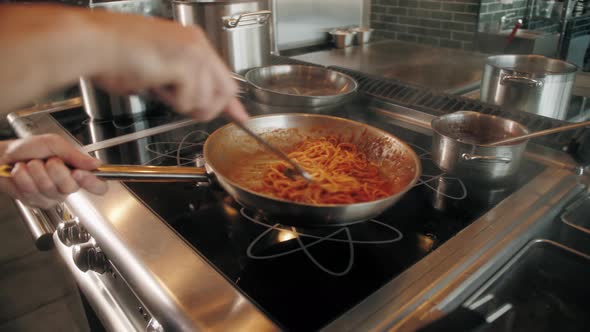 Chef Cooking Bolognese Fresh Pasta with Tomato Sause Man Making Traditional Italian Dinner on