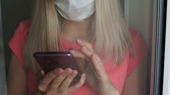 Girl Is Ill and Cannot Go Out, Uses Smartphone at Home Quarantine.