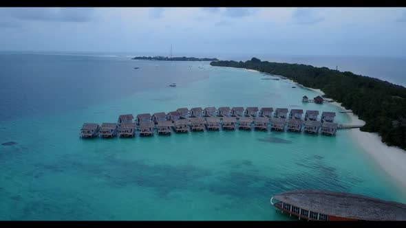 Aerial view landscape of exotic coast beach voyage by aqua blue lagoon and bright sandy background o