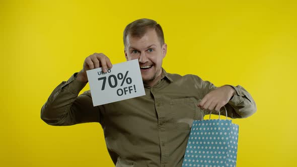 Man Showing Up To 70 Percent Off Inscription From Shopping Bag, Rejoicing Discounts, Low Prices