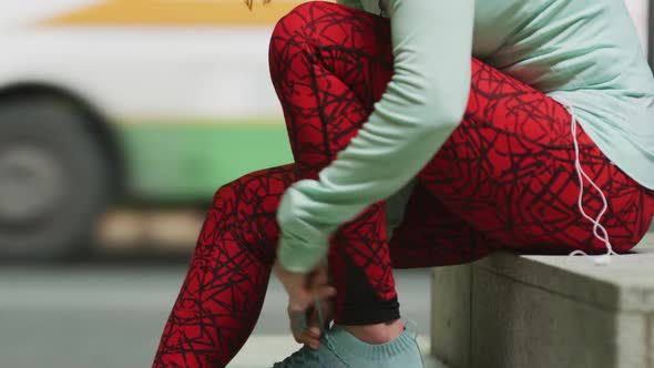 Young woman preparing to run