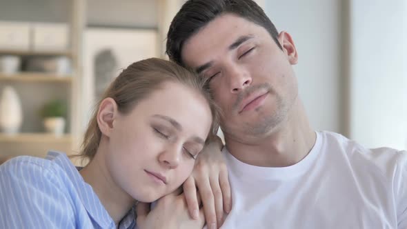 Close Up of Sleeping Young Couple on Couch