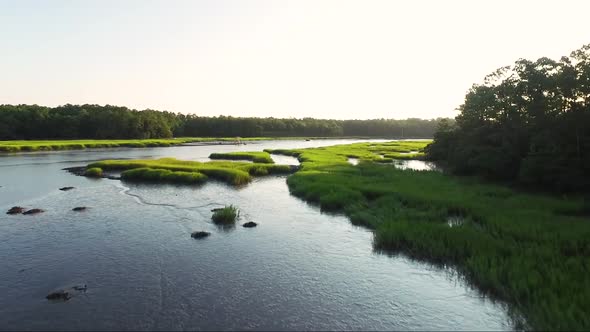 Low flying drone over waterway in Calabash NC at sunrise