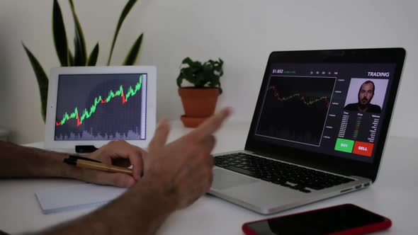 Young Investor Making a Video Call with a Professional Trader to Learn Investing