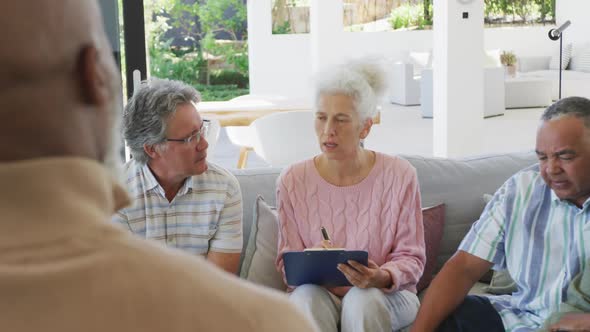 Senior diverse people at meeting talking at retirement home
