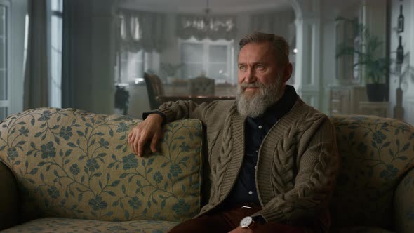 Handsome Old Man Sitting Couch in Luxury House