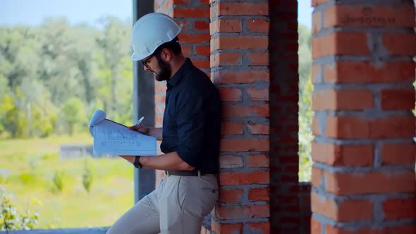 Specialist Builder Construction Architect Inspecting Renovation Object.  Builder Foreman On Jobsite