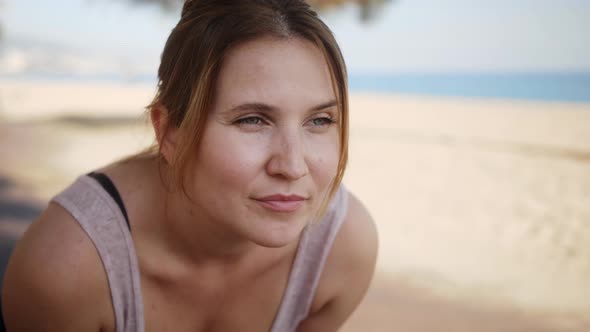 Tired Runner Woman Breathing After Run Marathon on the Beach