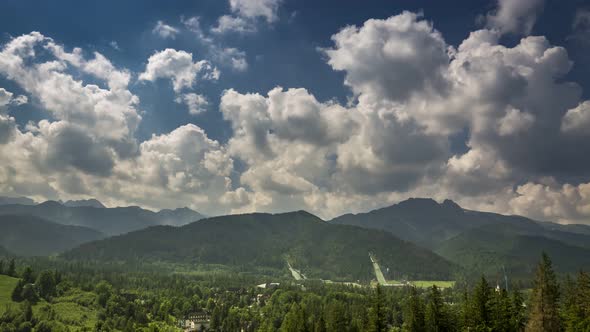 Ski jump and mount Giewont in cloudy day, Zakopane, Poland, timelapse, 4K