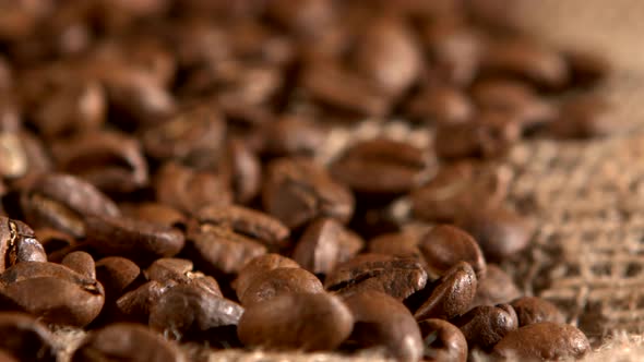 Coffee Beans on Burlap Sacking Background and Dynamic Change of Focus, Rotation, Close Up