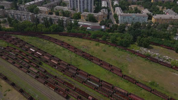 High Angle View of an Old Railway Station with Lots of Rusty Train Trailers