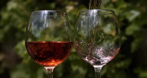 Pink Wine being poured into Glass, Slow motion 4K