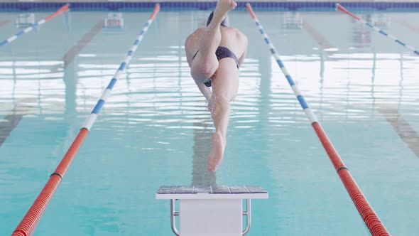 Swimmer diving into the pool