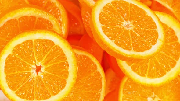 Super Slow Motion Shot of Flying Fresh Orange Slices Towards Camera at 1000 Fps
