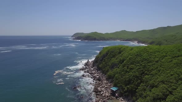 View From a Droneon a Stone Cape Washed By Strong Waves