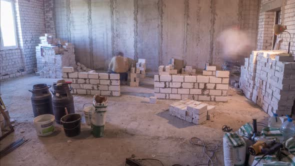 Builders Laying Brick Walls Inside Appartment with Professional Timelapse