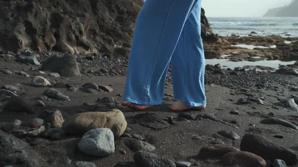 Two Beautiful Woman Walk Along the Volcanic Beach of Tenerife