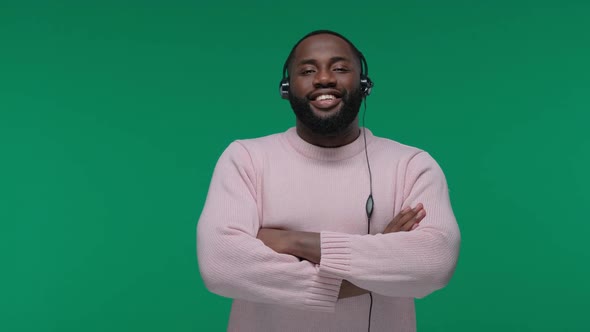 Smiling African American Customer Support Man Wearing Headset Isolated on Green Screen Chroma Key