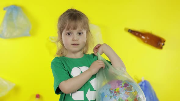 Girl Activist with Earth Globe in Plastic Package. Reduce Trash Pollution. Save Ecology Environment