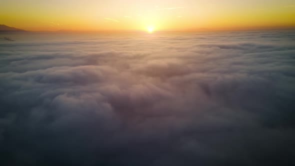 Aerial of the sunrise above the clouds