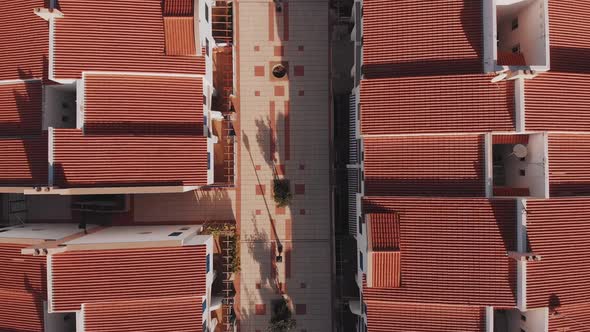 Orange rooftops of modern town from above
