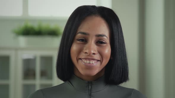 Portrait Of A Beautiful African American Woman Smiling Into Camera