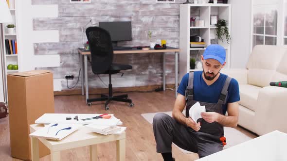 Male Worker Checking to Have the Right Tools