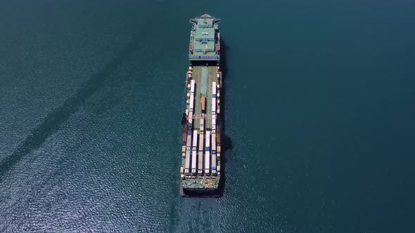 Aerial View of a Ferry Boat Transporting Trucks in the Sea